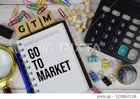 GTM Go to Market acronym on notepad, Business and Financial concept background 129862126