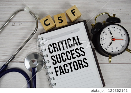CSF Critical Success Factors acronym on notepad, Healthcare and Medical concept background 129862141