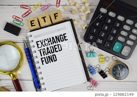 ETF Exchange Traded Fund acronym on notepad, business and financial concept background 129862149