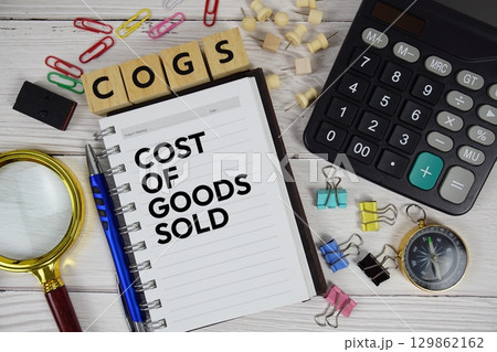 COGS - Cost of Goods Sold acronym on notepad, business and financial concept background 129862162