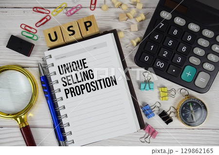 USP - Unique Selling Proposition acronym on notepad, business and financial concept background 129862165