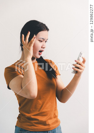 Asian girl expresses dislike, person express negative feeling, concept business complaint from customer ensuring employee satisfaction negative feedback to prevent mental strain customer dislike Asian girl expresses dislike, person express negative feeling, concept business complaint from customer ensuring employee satisfaction negative feedback to prevent mental strain customer dislike 129862277