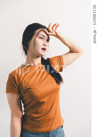 Asian girl expresses dislike, person express negative feeling, concept business complaint from customer ensuring employee satisfaction negative feedback to prevent mental strain customer dislike 129863136