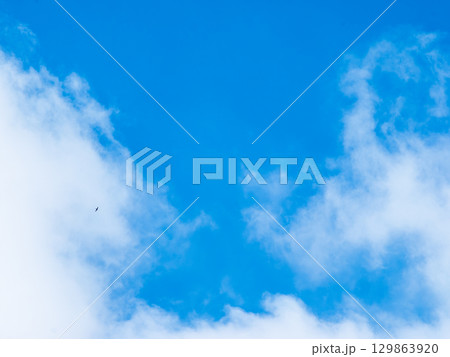 Blue sky with clouds background texture. Sky scape. 129863920