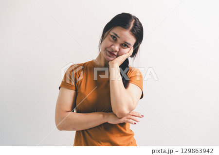 Asian girl expresses dislike, person express negative feeling, concept business complaint from customer ensuring employee satisfaction negative feedback to prevent mental strain customer dislike Asian girl expresses dislike, person express negative feeling, concept business complaint from customer ensuring employee satisfaction negative feedback to prevent mental strain customer dislike 129863942