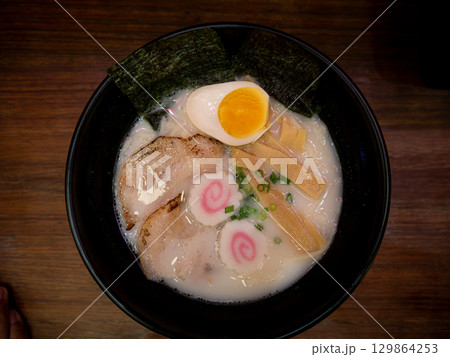 Traditional Japanese Tonkotsu Ramen with Chashu and Soft-Boiled Egg. 129864253