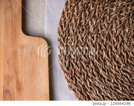 rattan weave, Wicker straw and wooden board. copy space background. 129864296