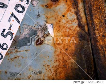 Old Grunge Metal Sheet with Rust and Wear Texture. 129864513