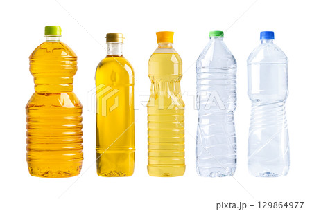 Vegetable oil with olive oil in different bottle for cooking isolated on white background. 129864977
