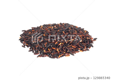 Black sticky rice pile isolated on white background 129865340