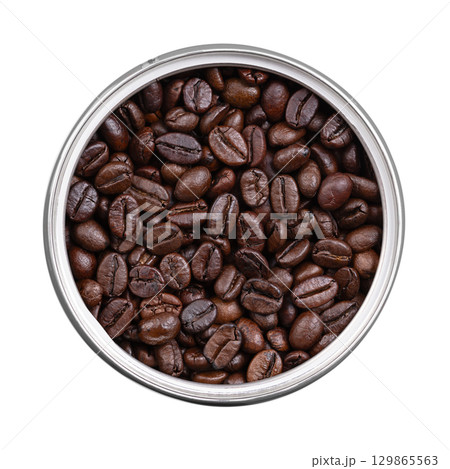 Roasted  Arabica coffee beans, in an opened tin can. Dark brown roasted seeds of berries from Coffea arabica, also known as Arabian, mountain or Arabica coffee. Close-up, isolated, from above. Photo 129865563