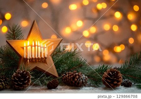 Elegant Hanukkah display with candlestick and glittering decorations in warm evening light 129866708