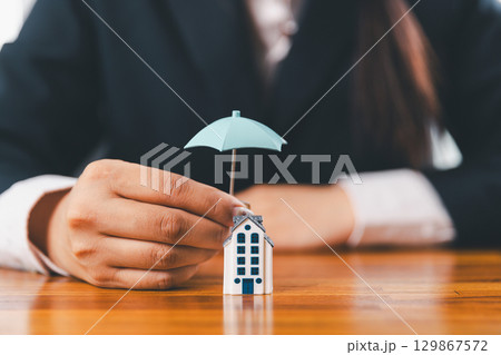 Home insurance and security concept. Real estate house insurance. Domino chain challenge risk. insurance risk management, property security, financial planning to safety, mortgage protect investment 129867572