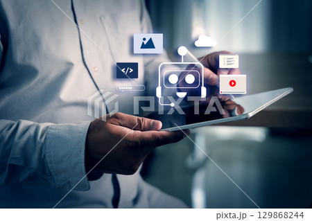 AI chatbot concept displayed with virtual assistant icons floating above a tablet as a person interacts with digital content and automation tools in a modern tech workspace. 129868244