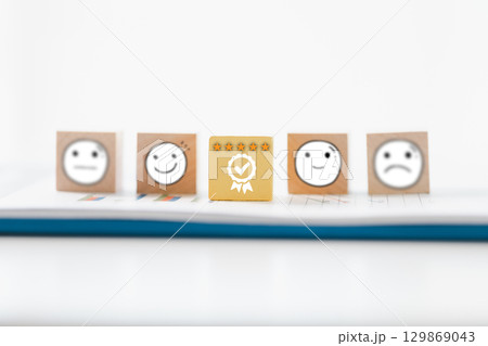 Customer showing rating with happy icon, Customer satisfaction survey concept, Positive feedback from happy client satisfaction with quality of service, marketing surveys, ratings, review, copy space 129869043