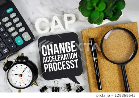 CAP Change Acceleration Process acronym with calculator, alarm clock and magnifying glass, business concept background 129869643