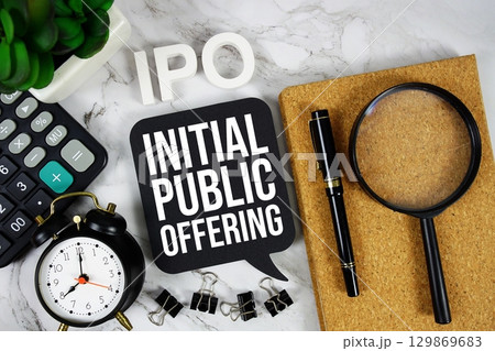 IPO Initial Public Offering acronym with calculator, alarm clock and magnifying glass, business concept background 129869683