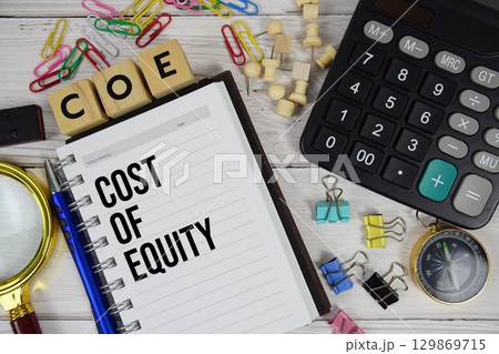 COE Cost of Equity acronym on notepad, Business and Financial concept 129869715