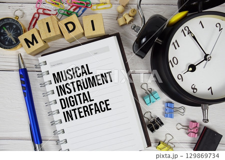 MIDI Musical Instrument Digital Interface acronym on notepad, Technology and software concept background 129869734