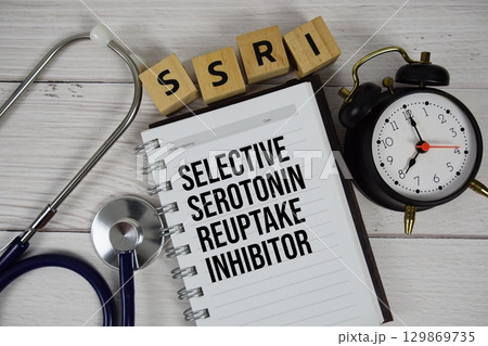 SSRI Selective Serotonin Reuptake Inhibitor acronym on notepad, Healthcare and Medical concept background SSRI Selective Serotonin Reuptake Inhibitor acronym on notepad, Healthcare and Medical concept background 129869735
