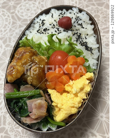 A traditional Korean dosirak, beautifully arranged with rice, assorted banchan, and savory proteins. Balanced and visually inviting, its a portable meal packed with vibrant flavors. A traditional Korean dosirak, beautifully arranged with rice, assorted banchan, and savory proteins. Balanced and visually inviting, its a portable meal packed with vibrant flavors. 129869922