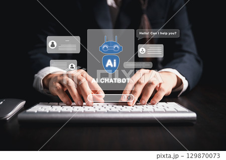 Businesswoman uses chatbot powered by AI technology and artificial intelligence to chat and converse with smart robot system analyzes data to help solve work-related problems. AI chatbot concept. 129870073