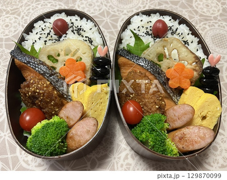 A traditional Korean dosirak, beautifully arranged with rice, assorted banchan, and savory proteins. Balanced and visually inviting, its a portable meal packed with vibrant flavors. A traditional Korean dosirak, beautifully arranged with rice, assorted banchan, and savory proteins. Balanced and visually inviting, its a portable meal packed with vibrant flavors. 129870099