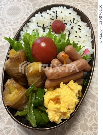 A traditional Korean dosirak, beautifully arranged with rice, assorted banchan, and savory proteins. Balanced and visually inviting, its a portable meal packed with vibrant flavors. A traditional Korean dosirak, beautifully arranged with rice, assorted banchan, and savory proteins. Balanced and visually inviting, its a portable meal packed with vibrant flavors. 129870110