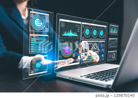 Woman in business uses computers and internet technology to perform SEO analysis, optimizing websites for search engine ranking and promoting increased traffic to boost website visibility. 129870140