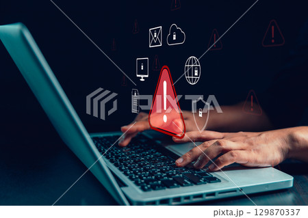 Businesswoman receives cyber security warning alert on smartphone and computer, data vulnerability, compromised information illegal, concept of digital threat protection. system detects network hack Businesswoman receives cyber security warning alert on smartphone and computer, data vulnerability, compromised information illegal, concept of digital threat protection. system detects network hack 129870337