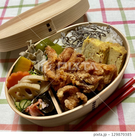 A traditional Korean dosirak, beautifully arranged with rice, assorted banchan, and savory proteins. Balanced and visually inviting, its a portable meal packed with vibrant flavors. 129870385