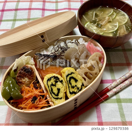 A traditional Korean dosirak, beautifully arranged with rice, assorted banchan, and savory proteins. Balanced and visually inviting, its a portable meal packed with vibrant flavors. A traditional Korean dosirak, beautifully arranged with rice, assorted banchan, and savory proteins. Balanced and visually inviting, its a portable meal packed with vibrant flavors. 129870386
