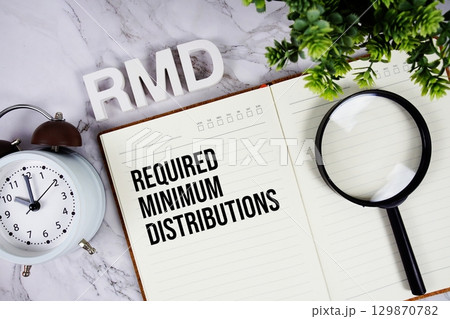 RMD Required Minimum Distributions acronym on notepad, Business concept background RMD Required Minimum Distributions acronym on notepad, Business concept background 129870782