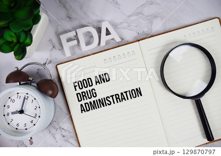 FDA Food and Drug Administration acronym on notepad, Healthcare concept background 129870797