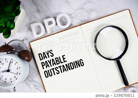 DPO Days Payable Outstanding acronym on notepad, Business concept background 129870811
