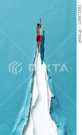 Creative digital artwork. Swimmer diving into torn paper path symbol of breakthrough and victory Creative digital artwork. Swimmer diving into torn paper path symbol of breakthrough and victory 129871081