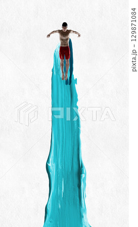 Creative collage. Swimmer diving straight down dynamic motion with blue energy trail Creative collage. Swimmer diving straight down dynamic motion with blue energy trail 129871084