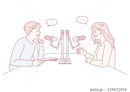 Diverse people talk in microphones at radio 129872034