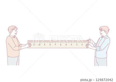 Men holding ruler making measurements 129872042