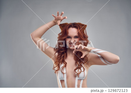 Sexy ginger woman in white underwear on white background 129872123