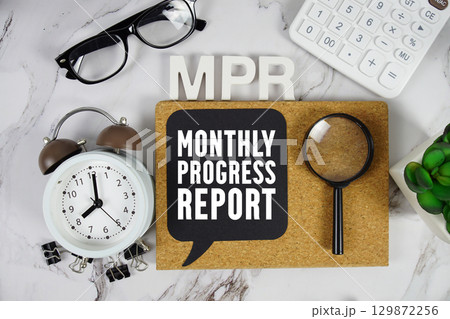 MPR Monthly Progress Report text with Calculator, alarm clock and magnifying glass on marble background MPR Monthly Progress Report text with Calculator, alarm clock and magnifying glass on marble background 129872256