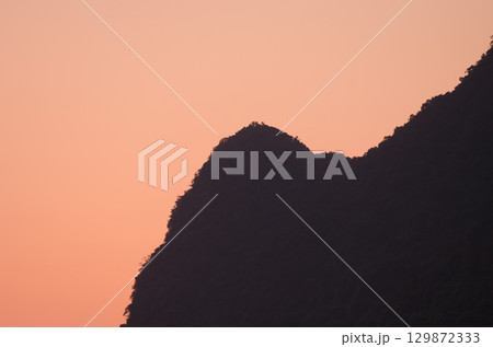 Cliff at sunset. Cliff at sunset. 129872333