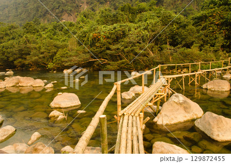 Wooden footbridge over the Chay River. Wooden footbridge over the Chay River. 129872455