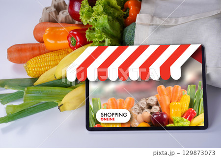 Online grocery shopping concept showing fresh Online grocery shopping concept showing fresh 129873073