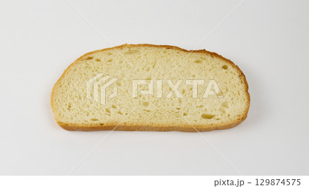 A single slice of soft white bread isolated 129874575