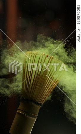 Freeze Motion Detail Shot of Sprinkling Matcha Powder on Stirrer 129876093