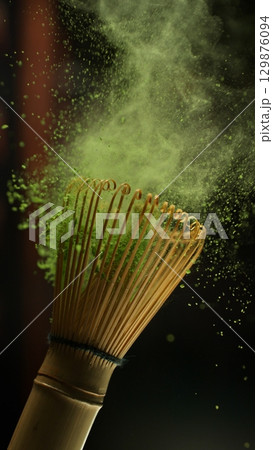 Freeze Motion Detail Shot of Sprinkling Matcha Powder on Stirrer 129876094