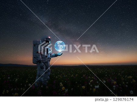 Astronaut in a pink flower garden 129876174