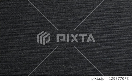 Black rough paper texture, close view paper pattern background 129877078