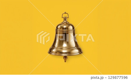 Metal bell over yellow background 129877596